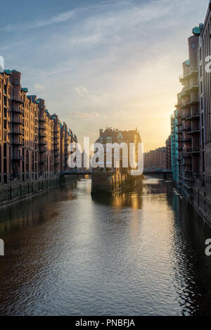 famous old warehouse district Speicherstadt in Hamburg, Germany at sunset