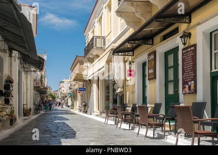 Main walking street with shops and cafes in Chora town on Andros island, Cyclades, Greece Stock Photo