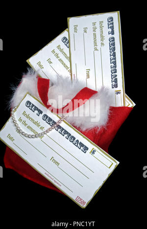 Holiday gift certificate in bag with pearls on black