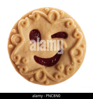 smiling cookie wink one eye filled with jam, isolated on white background Stock Photo