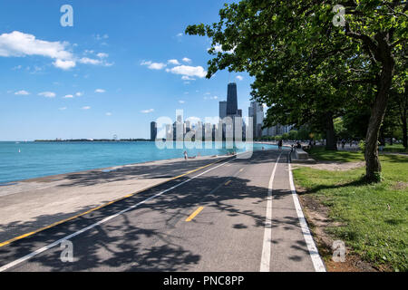 Lakefront Trail on Lake Shore Drive with a view of the Chicago, IL skyline. Stock Photo