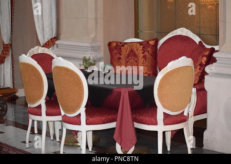 Ornate Chairs and Table in Italian Hotel Stock Photo