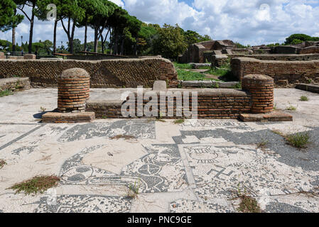 Rome. Italy. Ostia Antica. Mosaic paving, including a swastika, of Roman merchant office/shop on Piazzale delle Corporazioni (Square of the Guilds or  Stock Photo