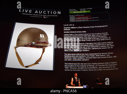 The helmet worn by Tom Hanks in Saving Private Ryan is auctioned as part of the the Prop Store Live Auction at the BFI Imax in central London, where over 270 rare props and costumes from the world of film and television are being sold. Stock Photo