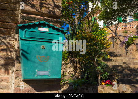 Traditional green mail box on the wall at the entrance to private house in Spain. Stock Photo