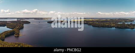 Panorama Finland Punkaharju, with lakes glistening between the grand pine trees growing on both sides of the ridge, is the best known national scenery Stock Photo