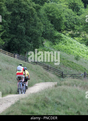 Two Mountain Bikers Mountain Biking in the Upper Derwent Valley Peak District National Park, South Yorkshire, England, UK in June Stock Photo