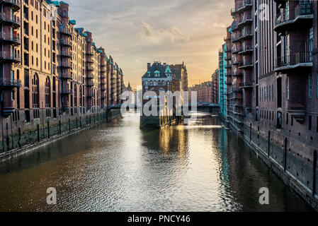 famous historic warehouse district Speicherstadt in Hamburg, Germany in evening sunlight Stock Photo