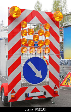 Direction Arrow Sign Signaling Traffic Diversion at Safety Trailer Stock Photo