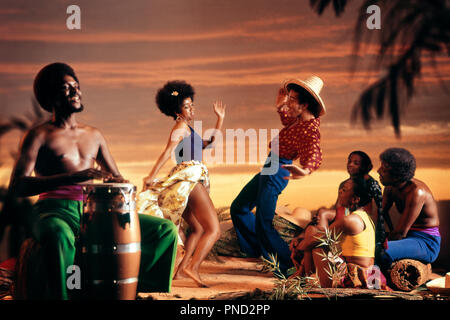 1960s 1970s WEST INDIAN STYLE DANCERS WITH DRUMMER ON TROPICAL BEACH AND TOURISTS HOLIDAY MAN WOMAN FAD NOSTALGIA FOLK - kd2794 PHT001 HARS MUSICAL ETHNIC NOSTALGIC PAIR COMMUNITY DRUM DIVERSITY COLOR RELATIONSHIP ISLAND DANCERS OLD TIME NOSTALGIA SUNSET MOVING OLD FASHION STYLE COMMUNICATION TROPICAL YOUNG ADULT TEAMWORK WEST MOVEMENT JOY LIFESTYLE ACTOR MUSICIAN CELEBRATION FEMALES RURAL GROWNUP MOTION COPY SPACE FULL-LENGTH HALF-LENGTH LADIES PERSONS GROWN-UP MALES CARIBBEAN PAIRS ENTERTAINMENT SPIRITUALITY AMERICANS PARTYING MOVE MEN AND WOMEN DANCES PERFORMING ARTS CELEBRATING MINORITY Stock Photo