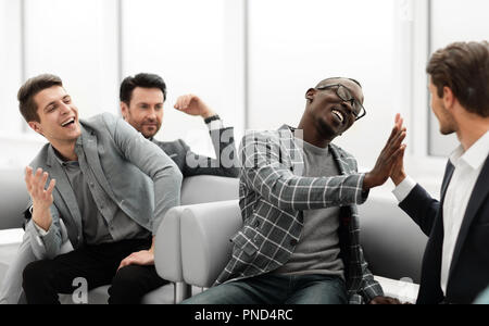 close up.cheerful co-workers giving each other a high five Stock Photo