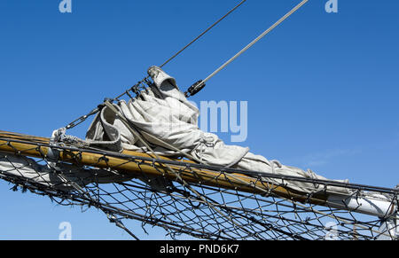 Furled jib sail on bowsprit of S/V Denis Sullivan, Milwaukee, WI Discovery World schooner Stock Photo