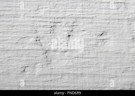 Decorative plaster effect on wall. white plaster lighted by daylight Stock Photo