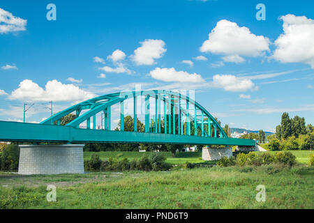 Green Railway bridge over Sava river in Zagreb and modern skyline Stock Photo