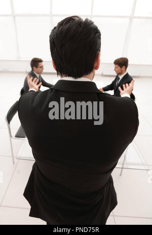 rear view.businessman holds a working meeting. Stock Photo