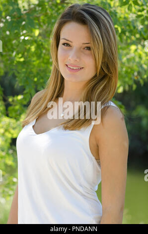 Portrait of a beautiful young blonde woman smiling Stock Photo