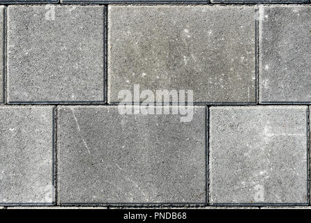 Concrete or cobble gray pavement slabs or stones  for floor, wall or path. Traditional fence, court, backyard or road paving. Stock Photo