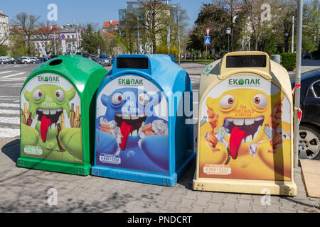 Recycling containers on the street for (L-R) glass, paper and plastic in Sofia, Bulgaria. Stock Photo