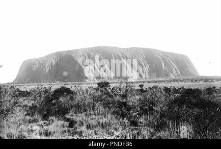 Uluru, Ayers Rock, central Australia, 1894. Date/Period: 1894. Image. Glass plate negative Glass plate negative. Height: 80 mm (3.14 in); Width: 106 mm (4.17 in). Author: Walter Baldwin Spencer. Stock Photo