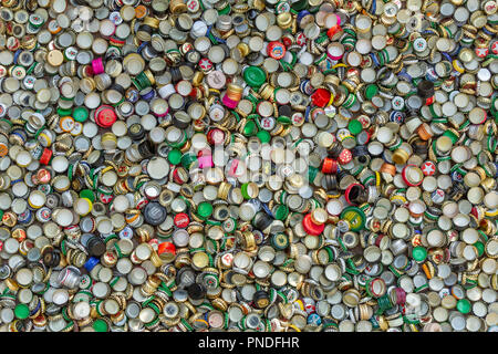Berlin, Germany, 12.05.2018, enormous quantity of metal beer caps, alcoholic beverages caps and jar caps in golden, red, green, blue, white, silver et Stock Photo