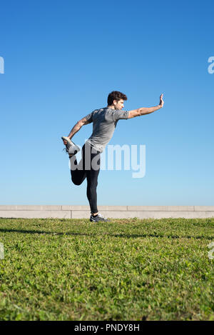 man stretches the body before running space for text down Stock Photo