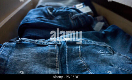 Denim trousers pants drawer folded Stock Photo