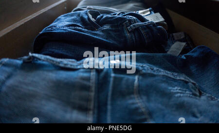 Denim trousers pants drawer folded Stock Photo
