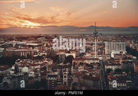 Milan city skyline viewed from above at sunset in Italy.