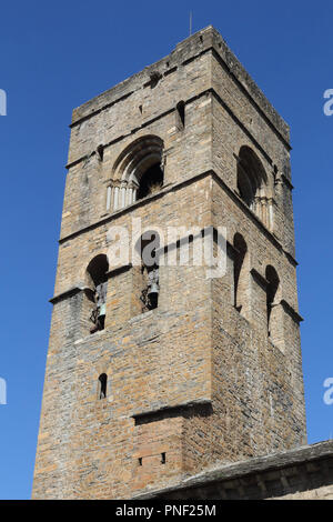 The stone bell tower of the romaneque Holy Mary Church (Iglesia de Santa Maria) in Ainsa, a small rural village in the Spanish Aragonese Pyrenees Stock Photo