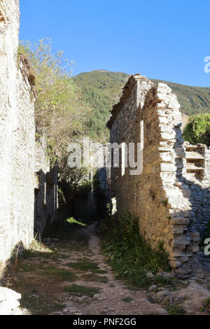 The empty ruins of the houses in the abandoned streets of Janovas, a ruined village in the Aragonese Pyrenees, Spain Stock Photo