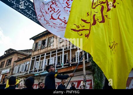 September 21, 2018 - Srinagar, J&K, India - A Kashmiri Shiite mourner seen holding a flag during a mourning procession on the tenth day of Ashura.Ashura is the tenth day of Muharram, the first month of the Islamic calendar, observed around the world in remembrance of the martyrdom of Imam Hussain, the grandson of Prophet Muhammad. Credit: Saqib Majeed/SOPA Images/ZUMA Wire/Alamy Live News Stock Photo