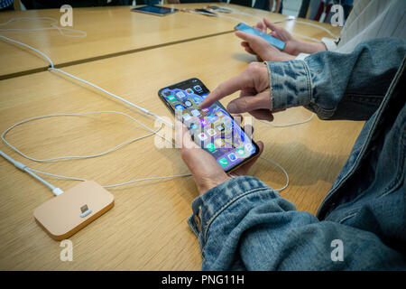 New York, USA. 21st September 2018. Customers in the Apple store in the WTC Transportation Hub in New York try out the new iPhone XS on Friday, September 21, 2018, the first day they went on sale.  The new phones, anxiously awaited by drooling iPhone aficionados, sell for a whopping $999 for the XS and $1099 for the XS Max with the Max having a 6.5 inch display.  (Â© Richard B. Levine) Credit: Richard Levine/Alamy Live News Credit: Richard Levine/Alamy Live News Stock Photo