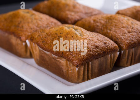 Mini Banana Loafs on a white tray showing close up view Stock Photo