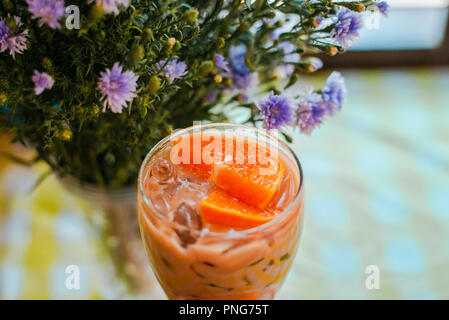 Glass bowl, topped with orange slice Stock Photo