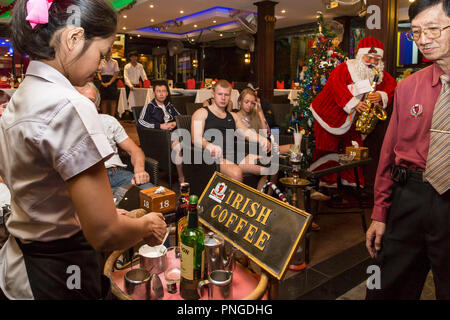 Father Christmas in a bar on Walking Street,Pattaya, Thailand Stock Photo