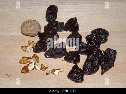 Dry plums and walnuts close-up Stock Photo