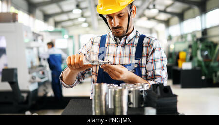industrial factory employee working in metal manufacturing industry Stock Photo