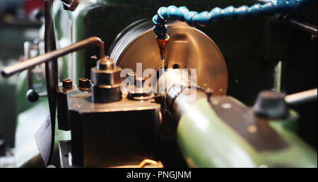 Finishing metal working on high precision grinding machine in workshop Stock Photo