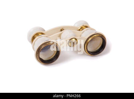 Old opera glasses. Vintage white binoculars for the theater. Stock Photo