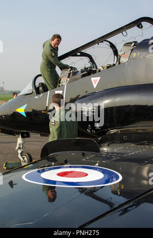 Pilot Matt Barker RAF, Royal Air Force solo BAe Hawk air display pilot with BAe Hawk T1 jet trainer plane at London Southend Airport for the airshow Stock Photo