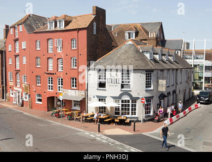 Old historic buildings on quayside at Poole harbour, Poole, Dorset, England, UK Stock Photo