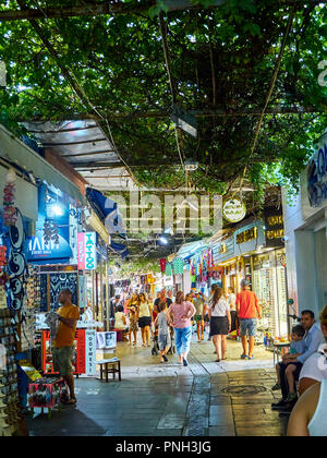 Bodrum, Turkey - July 5, 2018. Tourists do shopping in the streets of Bodrum downtown bazaar. Mugla Province, Turkey. Stock Photo