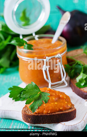 Bread toasts with eggplant caviar. Vegan meal. Healthy vegetarian food.  Aubergine caviar. Stock Photo