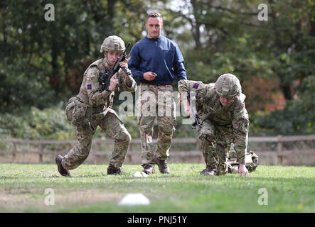 Soldiers demonstrate part of the Fire and Movement stage in the British ...