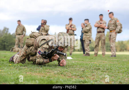 Soldiers demonstrate part of the Fire and Movement stage in the British ...