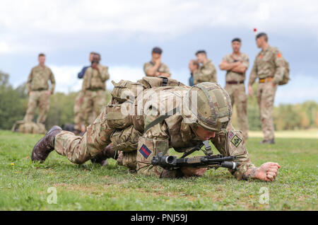 Soldiers demonstrate part of the Fire and Movement stage in the British ...