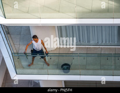 Male Window Cleaner Cleaning Balcony Glass Barrier Stock Photo Alamy