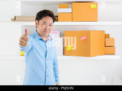 Owner small business entrepreneur have a box in warehouse to send to customer Stock Photo