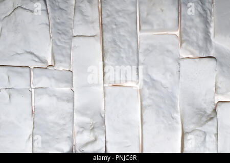 White brick wall plastic panel vertically oriented, may be used as background or texture Stock Photo