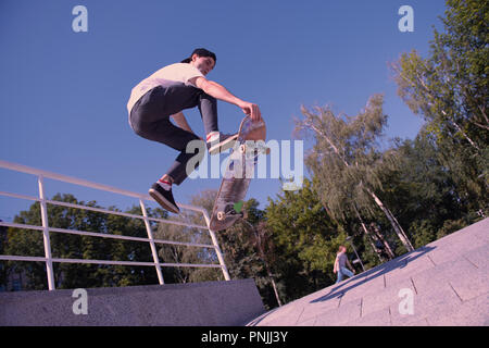 Profile photo of careful boy that demonstrating tricks Stock Photo
